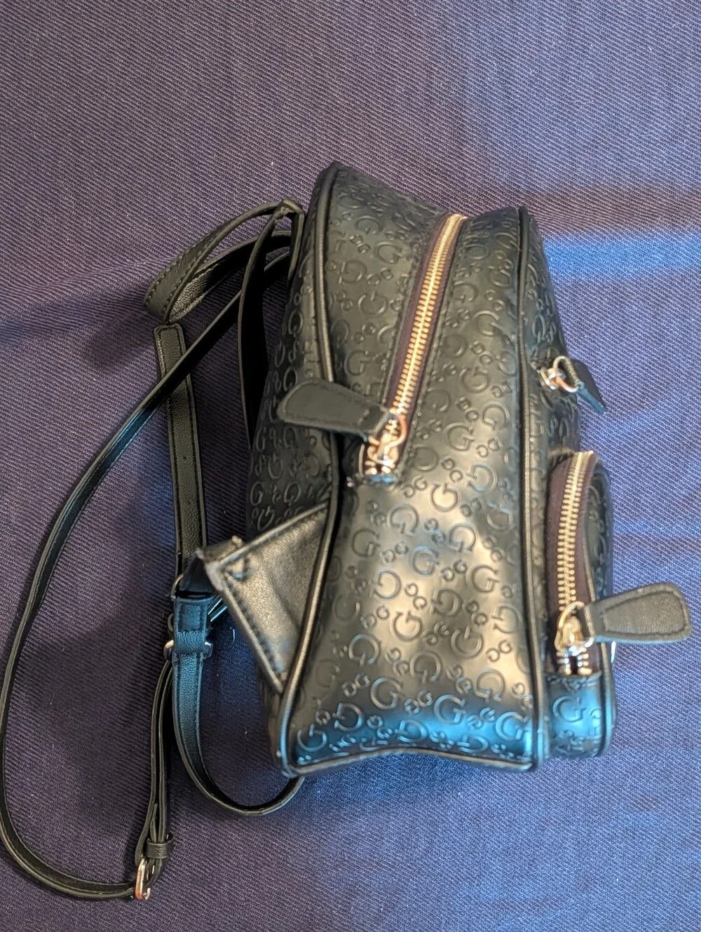 GUESS Black Embossed Logo Mini Backpack with Gold Accent